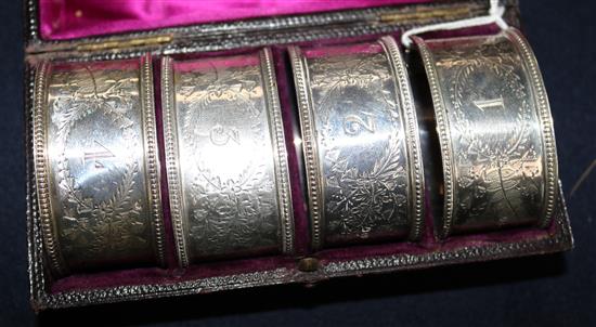 A cased set of four Victorian silver napkin rings by Atkin Brothers, Sheffield, 1884.